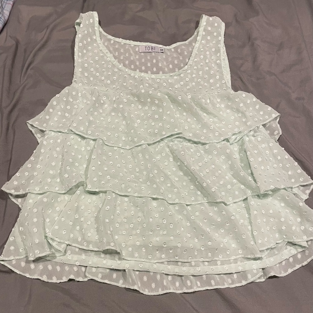 Teal/light green tank top with polka dots and ruffles